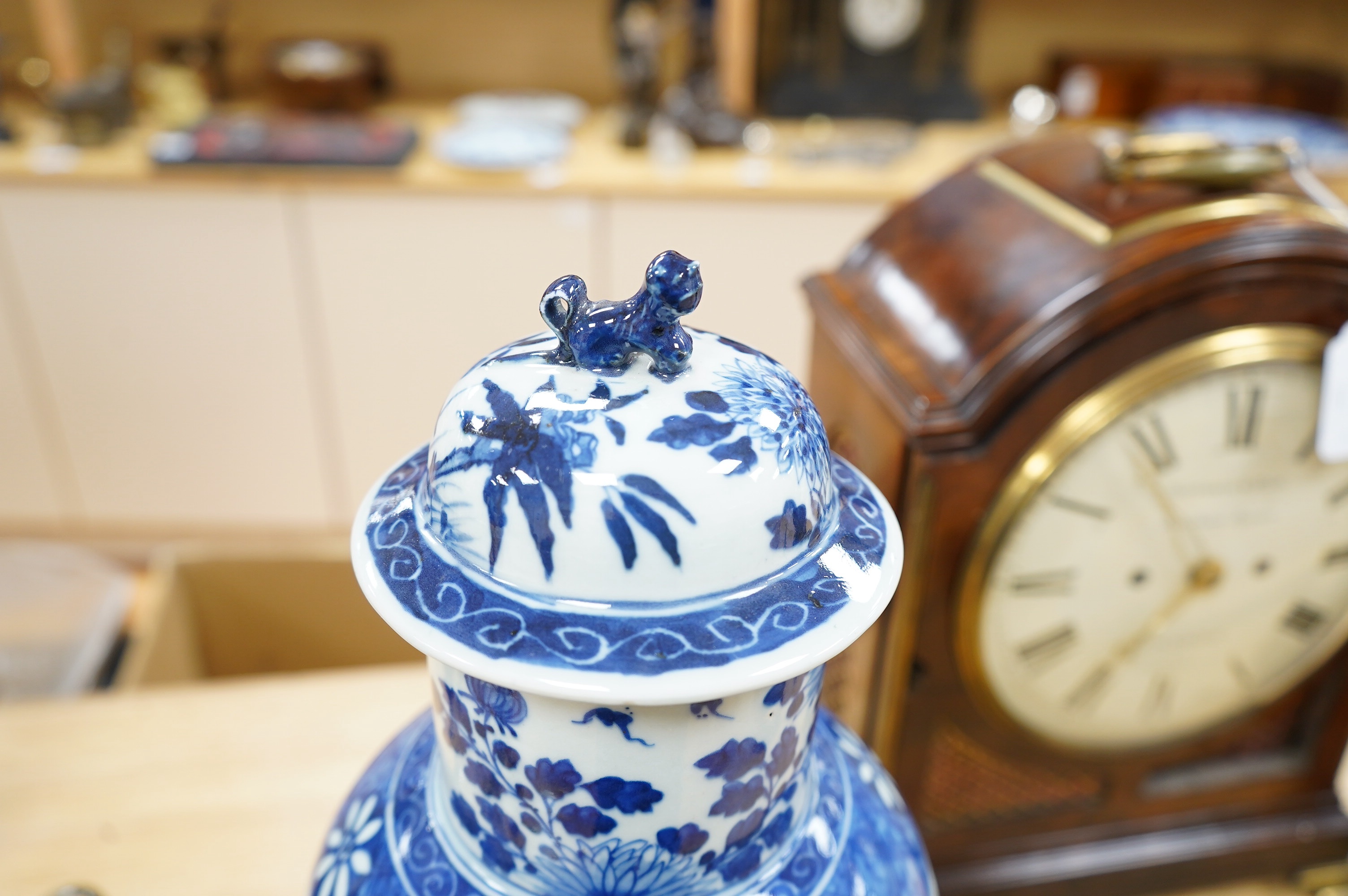 An early 20th century Chinese blue and white dragon vase and cover, 42cm high. Condition - crack and chip from rim of vase down the neck